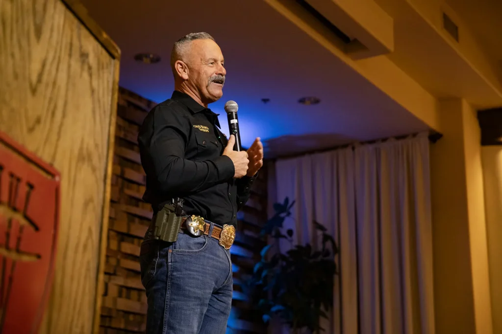 man speaking with microphone